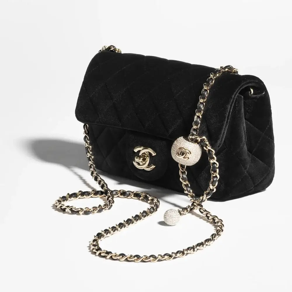 CHANEL
Velvet mini flap bag