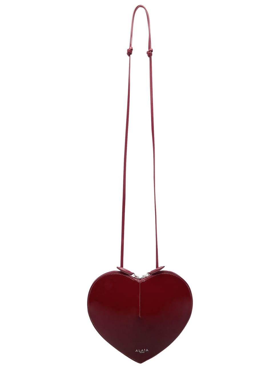 ALAÏA Le Coeur patent leather cross-body bag burgundy